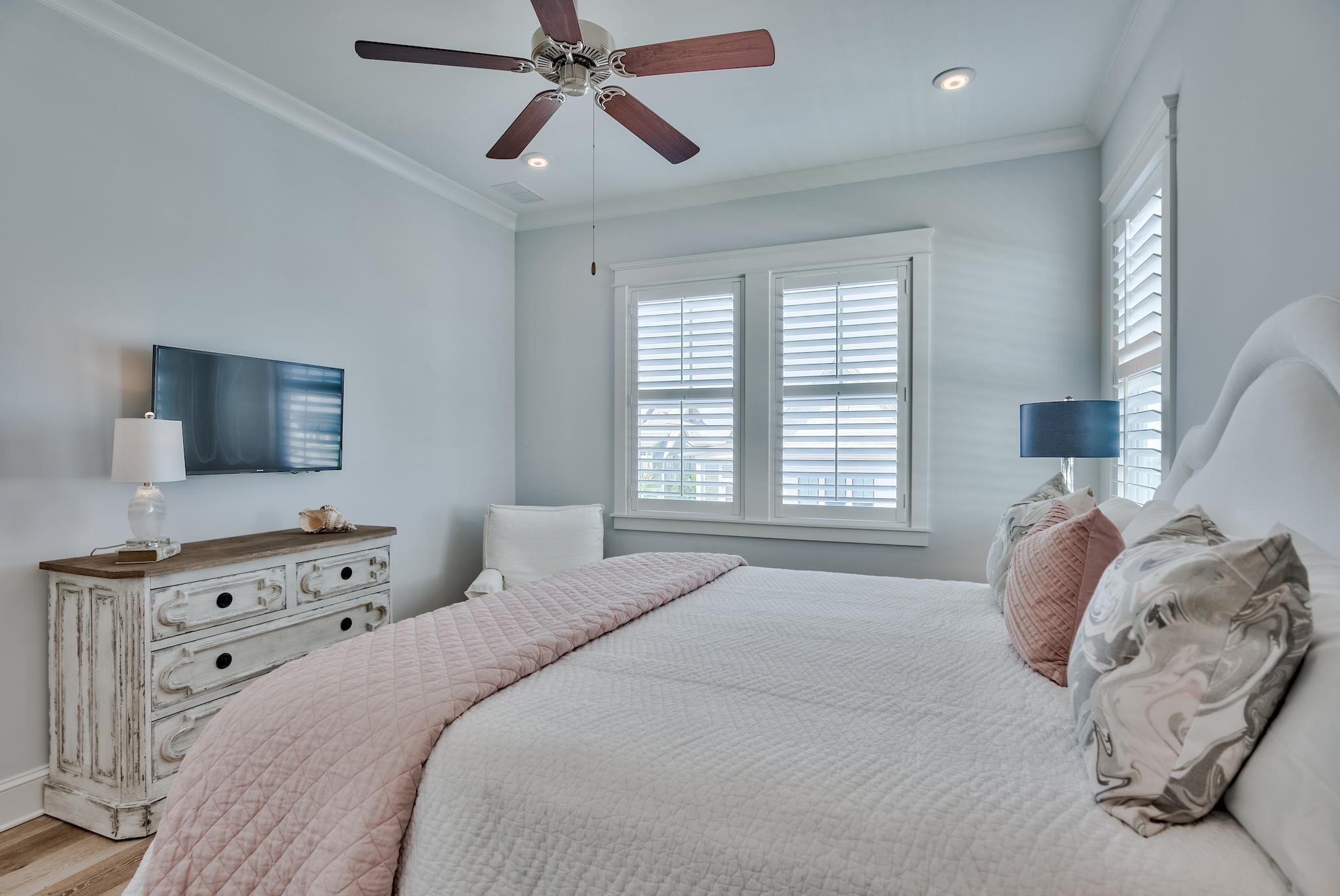 114 Clipper Street Inlet Beach, FL 32461 - Photo 26 of 64 a bedroom with a bed and a flat screen tv