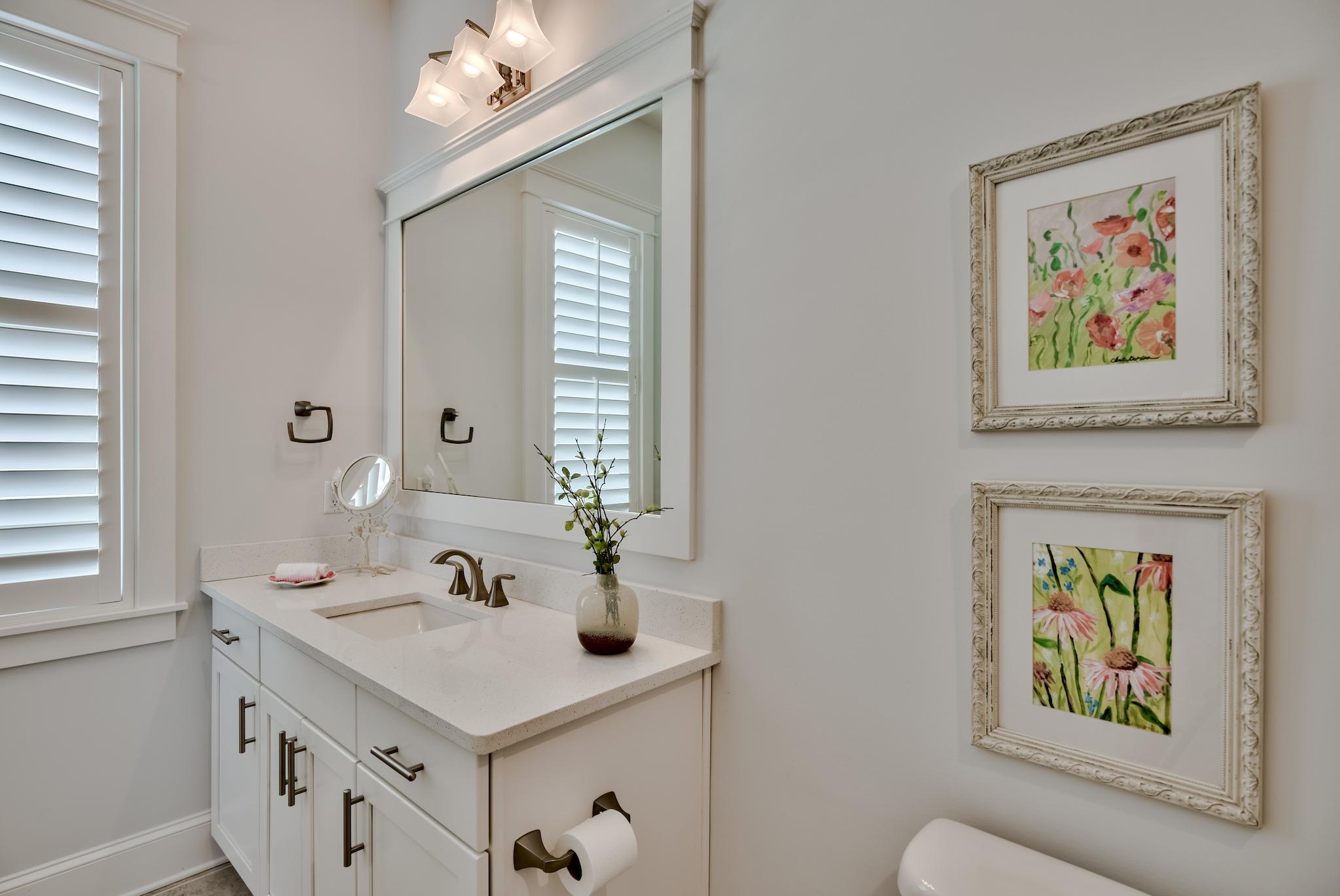 114 Clipper Street Inlet Beach, FL 32461 - Photo 27 of 64 a bathroom with a sink a large mirror and a window