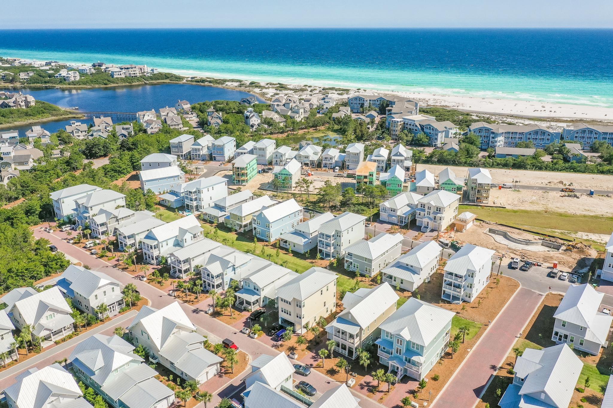 114 Clipper Street Inlet Beach, FL 32461 - Photo 41 of 64 an aerial view of a city with lots of residential buildings ocean and mountain view in back