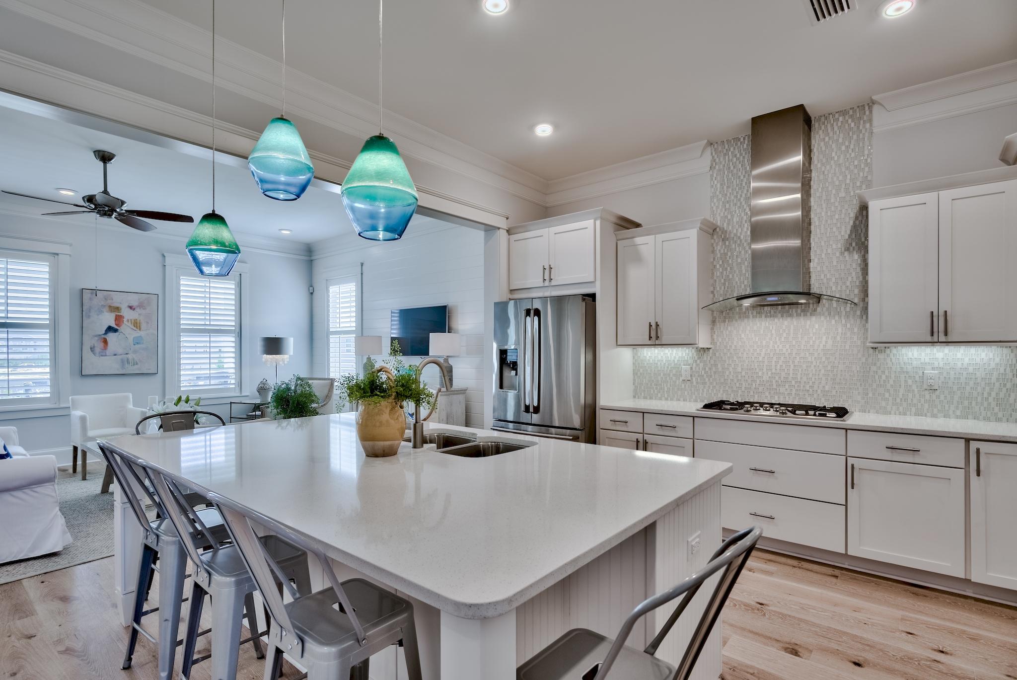 114 Clipper Street Inlet Beach, FL 32461 - Photo 7 of 64 a kitchen with stainless steel appliances a dining table and chairs