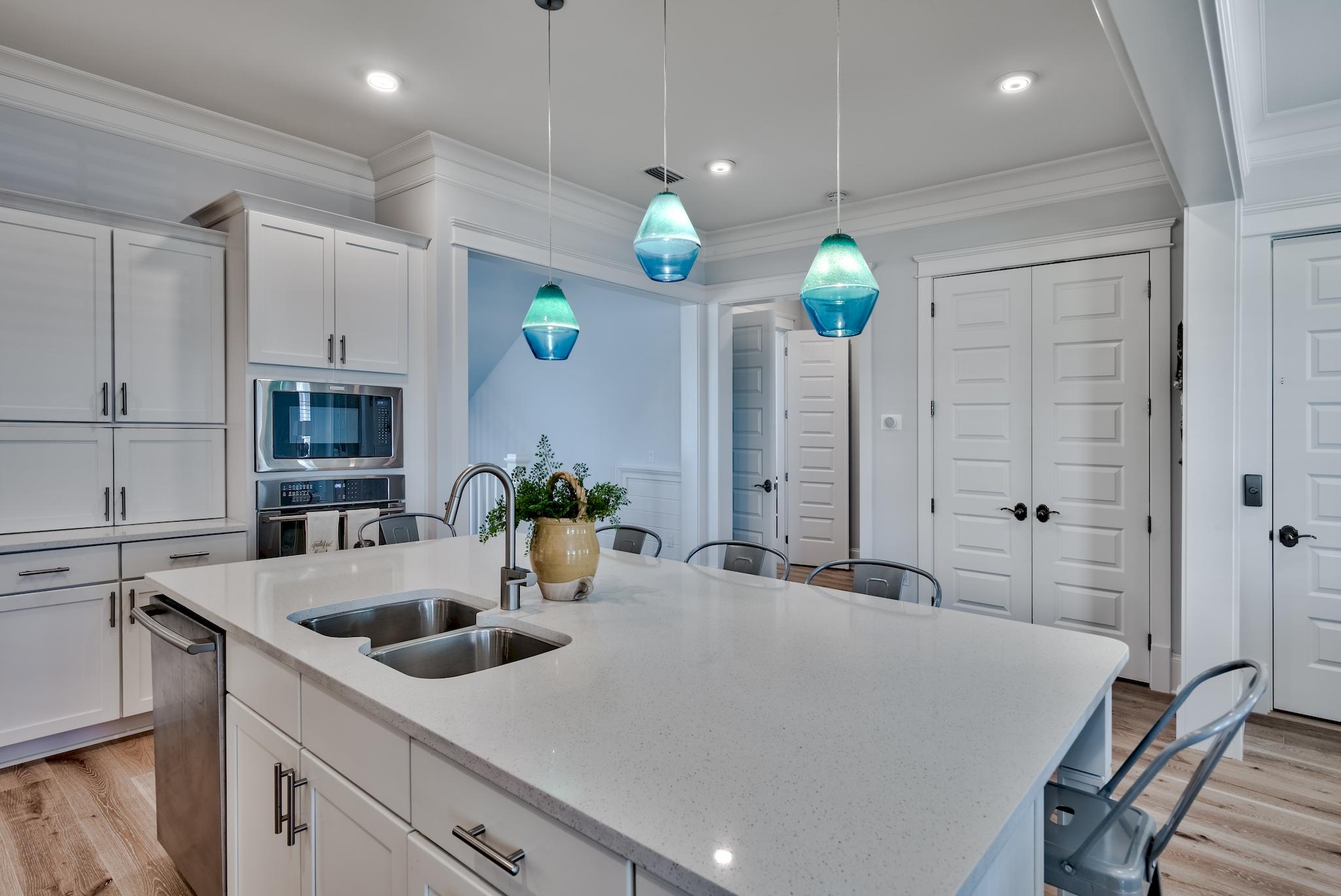 114 Clipper Street Inlet Beach, FL 32461 - Photo 10 of 64 a kitchen with cabinets and center island