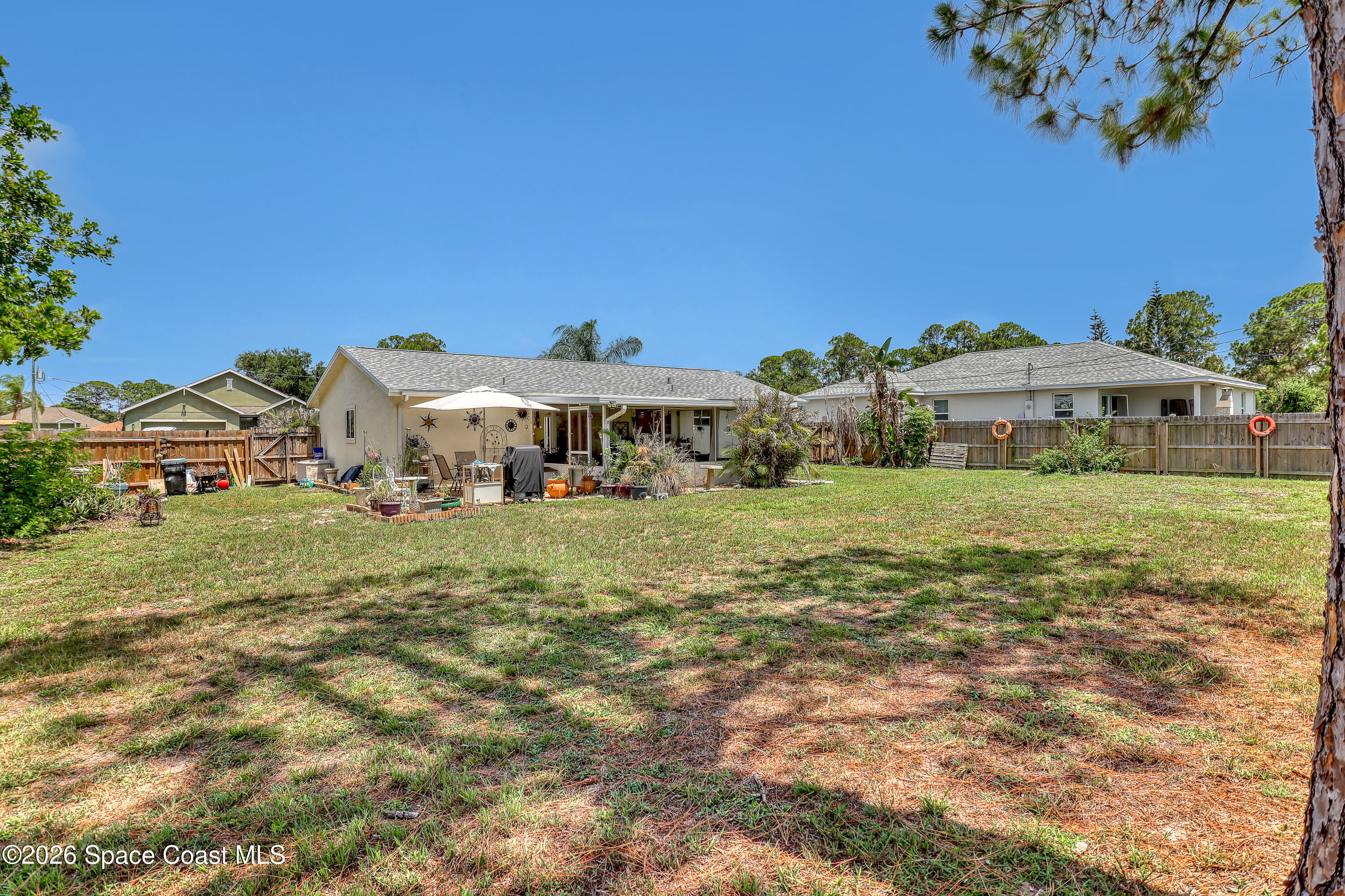 858 Carnival Road Southeast Palm Bay, FL 32909 - Photo 20 of 21 Back Yard South East View