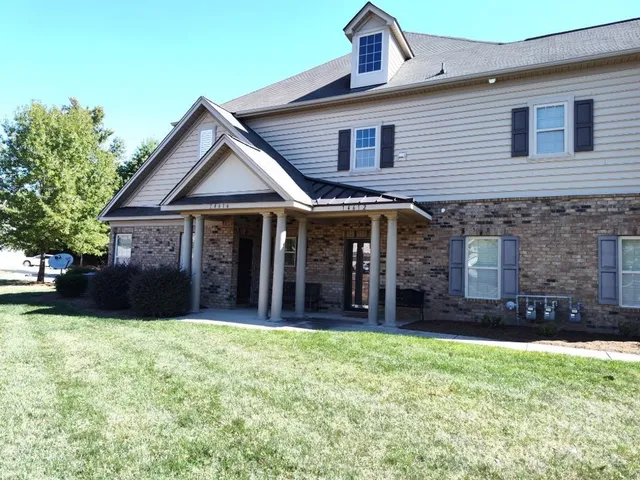 a house view with a garden space