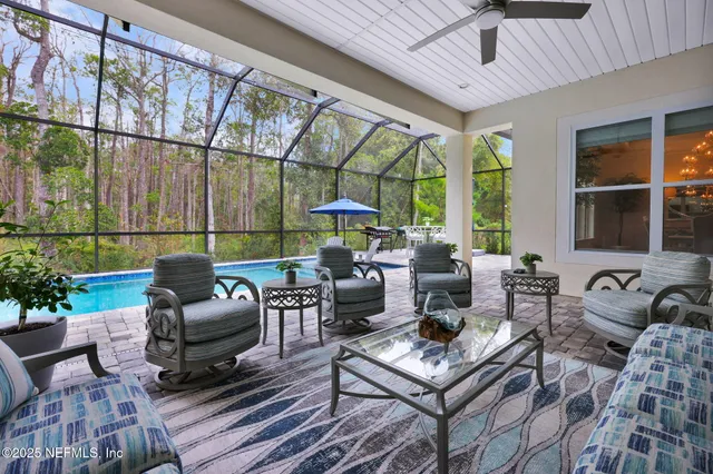 a view of a room with gym equipment and a large window