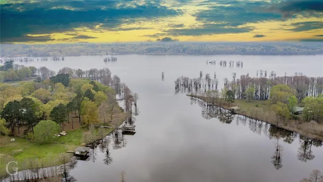 a view of a swimming pool next to a yard