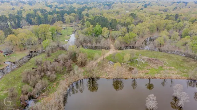 a view of a lake with a yard