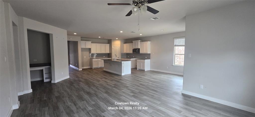 2340 Goodnight Ranch Drive Weatherford, TX 76087 - Photo 17 of 19 a view of kitchen with wooden floor electronic appliances and window