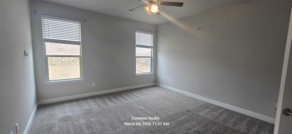 2340 Goodnight Ranch Drive Weatherford, TX 76087 - Photo 14 of 19 an empty room with windows and fan