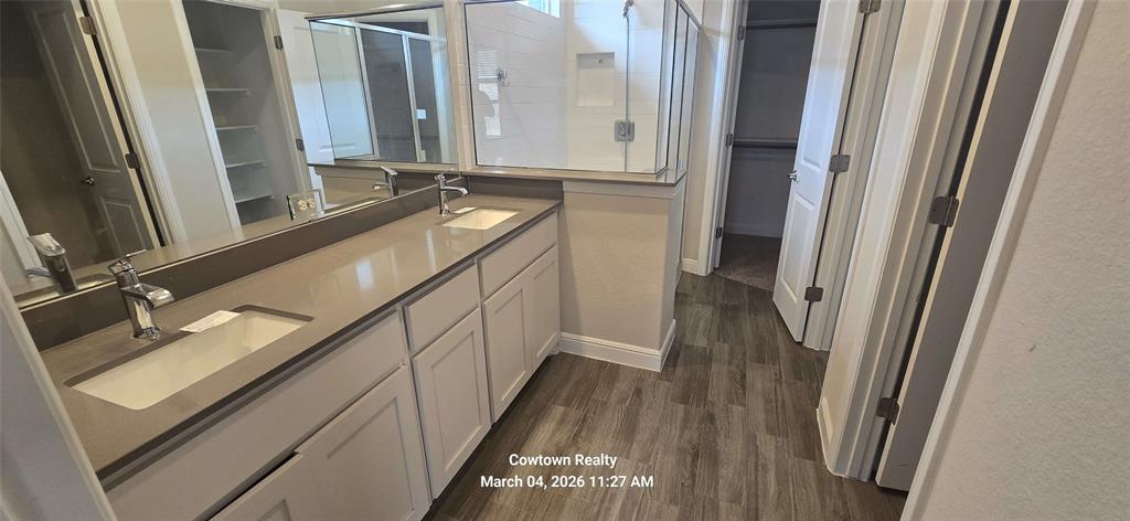 2340 Goodnight Ranch Drive Weatherford, TX 76087 - Photo 15 of 19 a bathroom with a sink a mirror and a bathtub