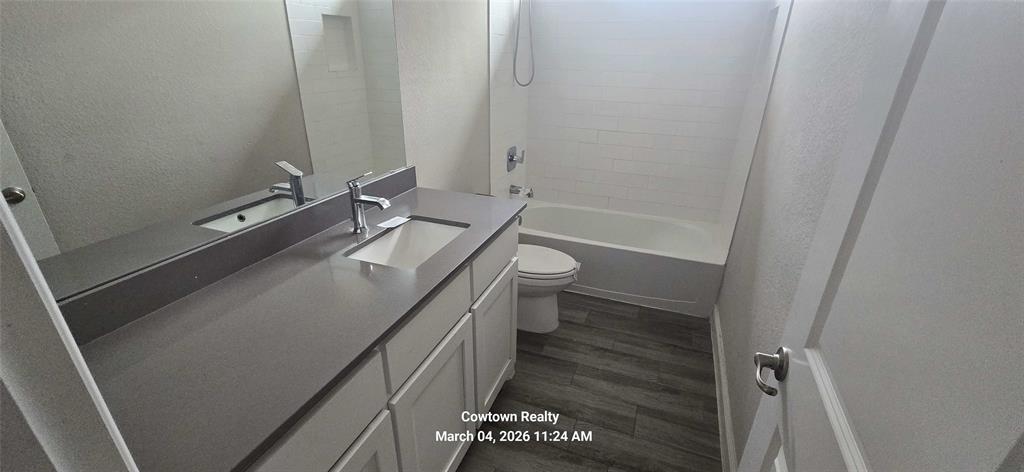 2340 Goodnight Ranch Drive Weatherford, TX 76087 - Photo 6 of 19 a bathroom with a sink a toilet and shower