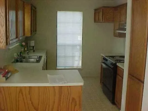 a kitchen with a refrigerator stove and a sink