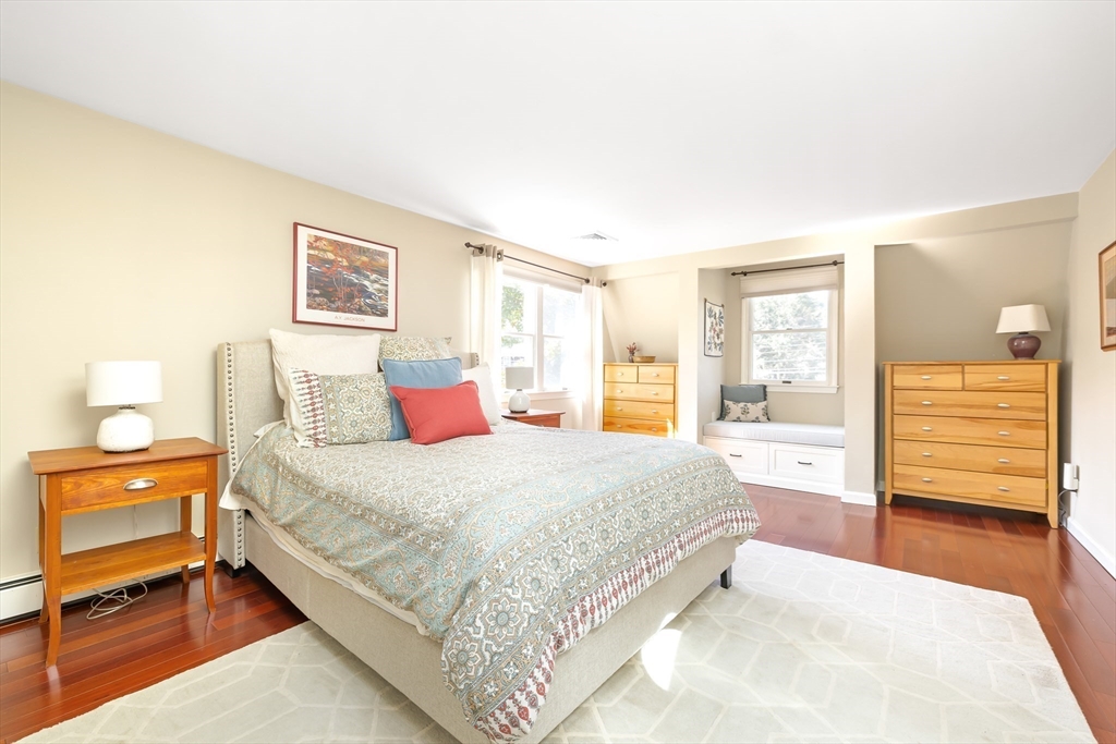 28 Cottage Street Natick, MA 01760 - Photo 13 of 32 a bedroom with a bed and wooden floor