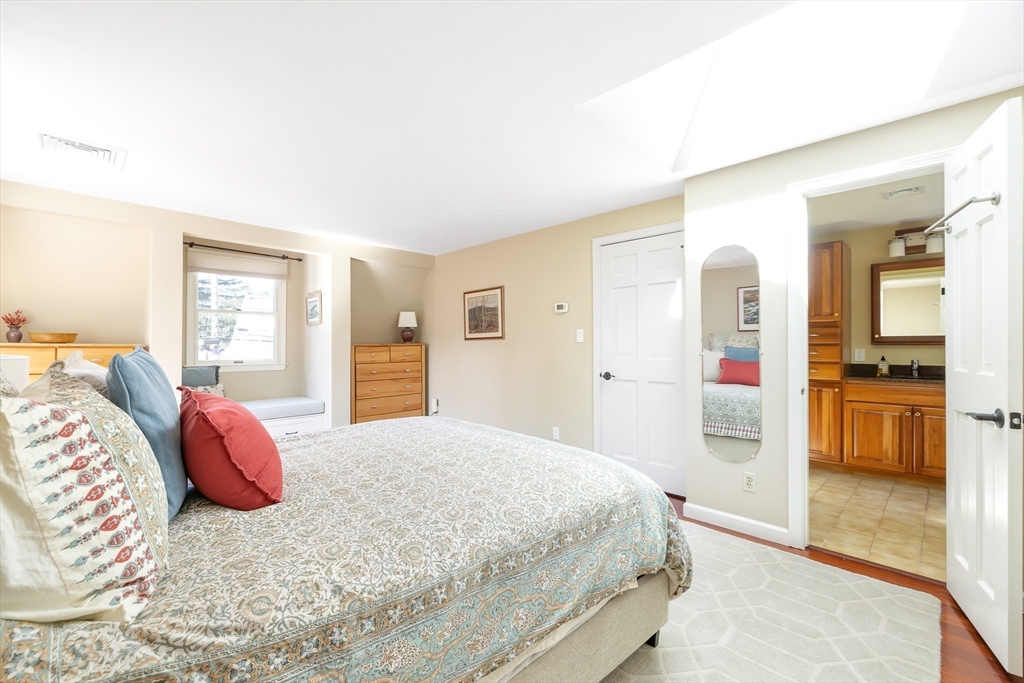 28 Cottage Street Natick, MA 01760 - Photo 14 of 32 a bedroom with a large bed and a dresser