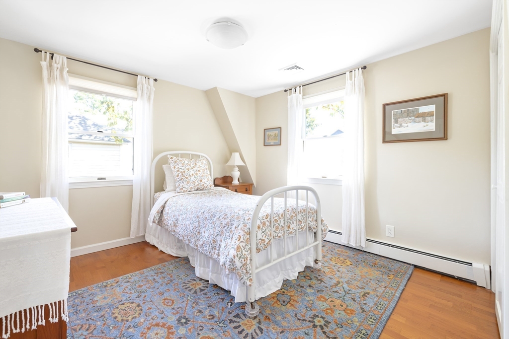 28 Cottage Street Natick, MA 01760 - Photo 18 of 32 a room with a bed and a window