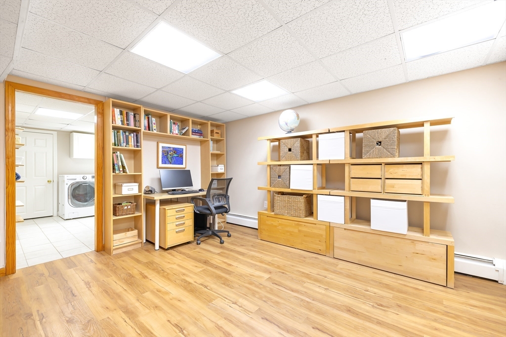 28 Cottage Street Natick, MA 01760 - Photo 23 of 32 a room with a bed and cabinets