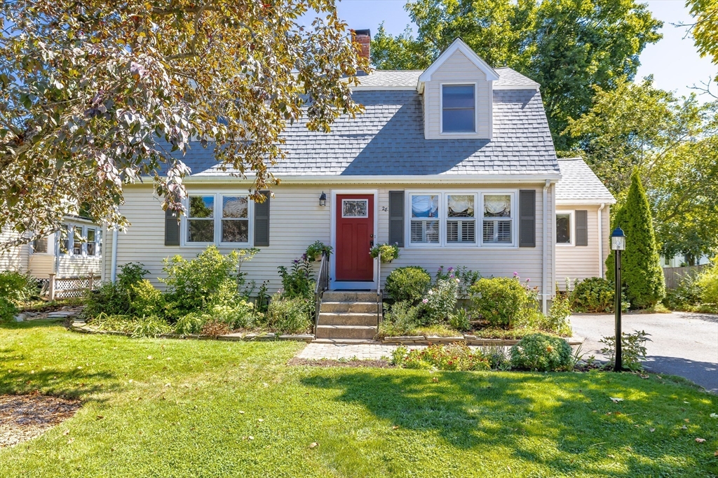 28 Cottage Street Natick, MA 01760 - Photo 30 of 32 a front view of a house with a yard