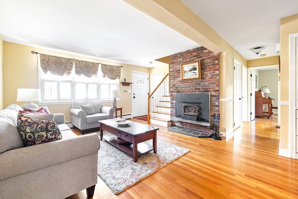 28 Cottage Street Natick, MA 01760 - Photo 3 of 32 a living room with furniture and a fireplace