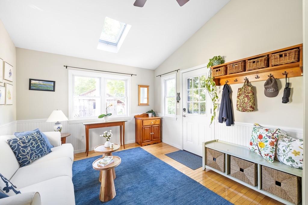28 Cottage Street Natick, MA 01760 - Photo 10 of 32 a living room with furniture and a wooden floor