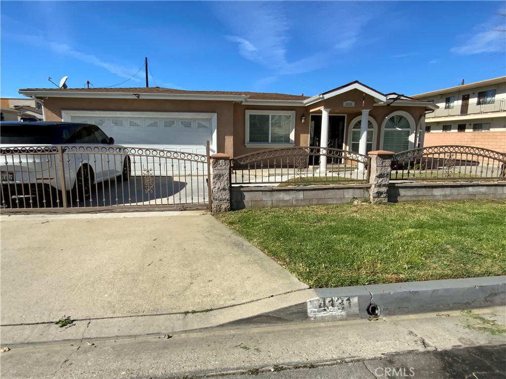 4131 Rowland Avenue El Monte, CA 91731 - Photo 1 of 22 front view of a house with a yard