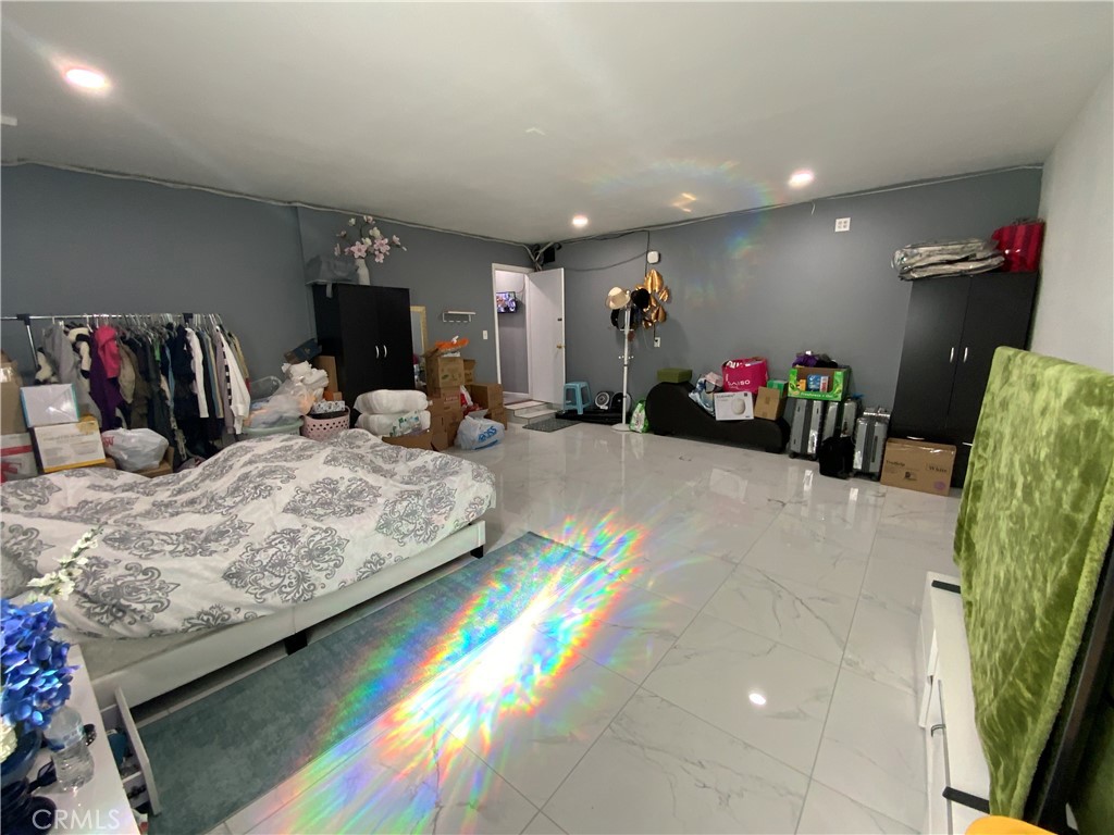 4131 Rowland Avenue El Monte, CA 91731 - Photo 12 of 22 a bedroom with bed and a couch