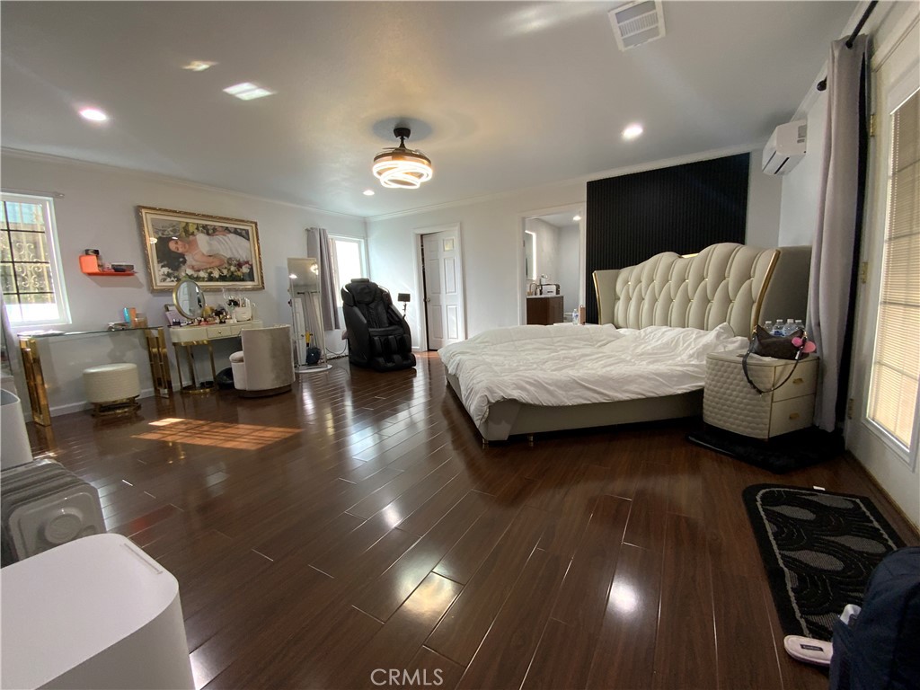 4131 Rowland Avenue El Monte, CA 91731 - Photo 15 of 22 a spacious bedroom with a bed and wooden floor