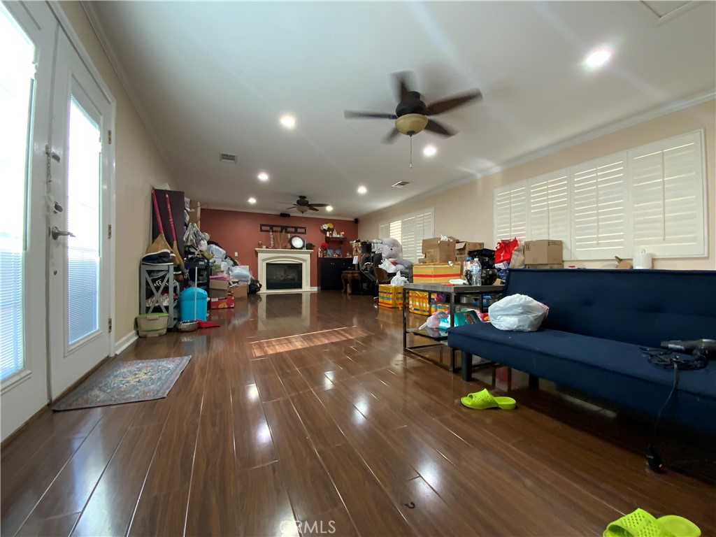 4131 Rowland Avenue El Monte, CA 91731 - Photo 19 of 22 a living room with lots of furniture and a chandelier