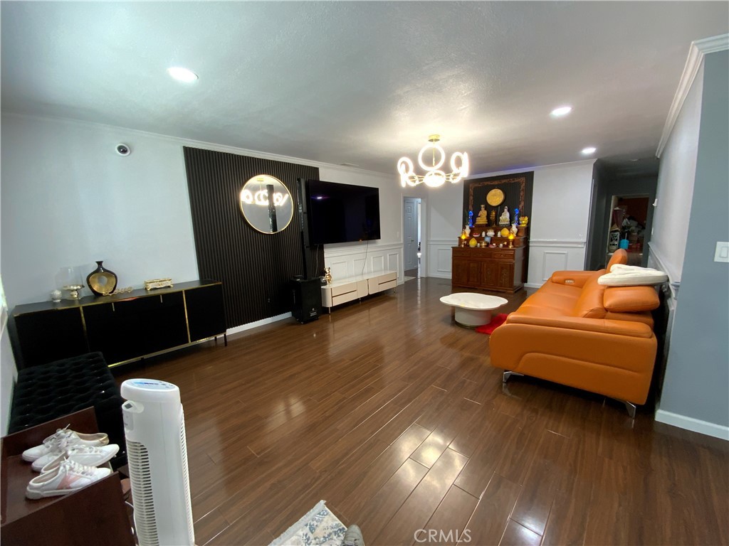 4131 Rowland Avenue El Monte, CA 91731 - Photo 3 of 22 a living room with furniture and a flat screen tv