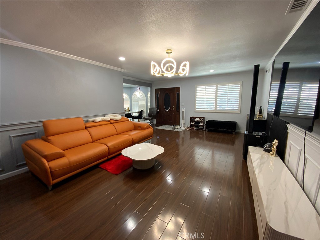 4131 Rowland Avenue El Monte, CA 91731 - Photo 4 of 22 a living room with furniture and a wooden floor