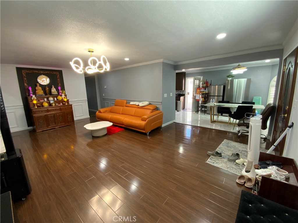 4131 Rowland Avenue El Monte, CA 91731 - Photo 5 of 22 a living room with furniture and a chandelier