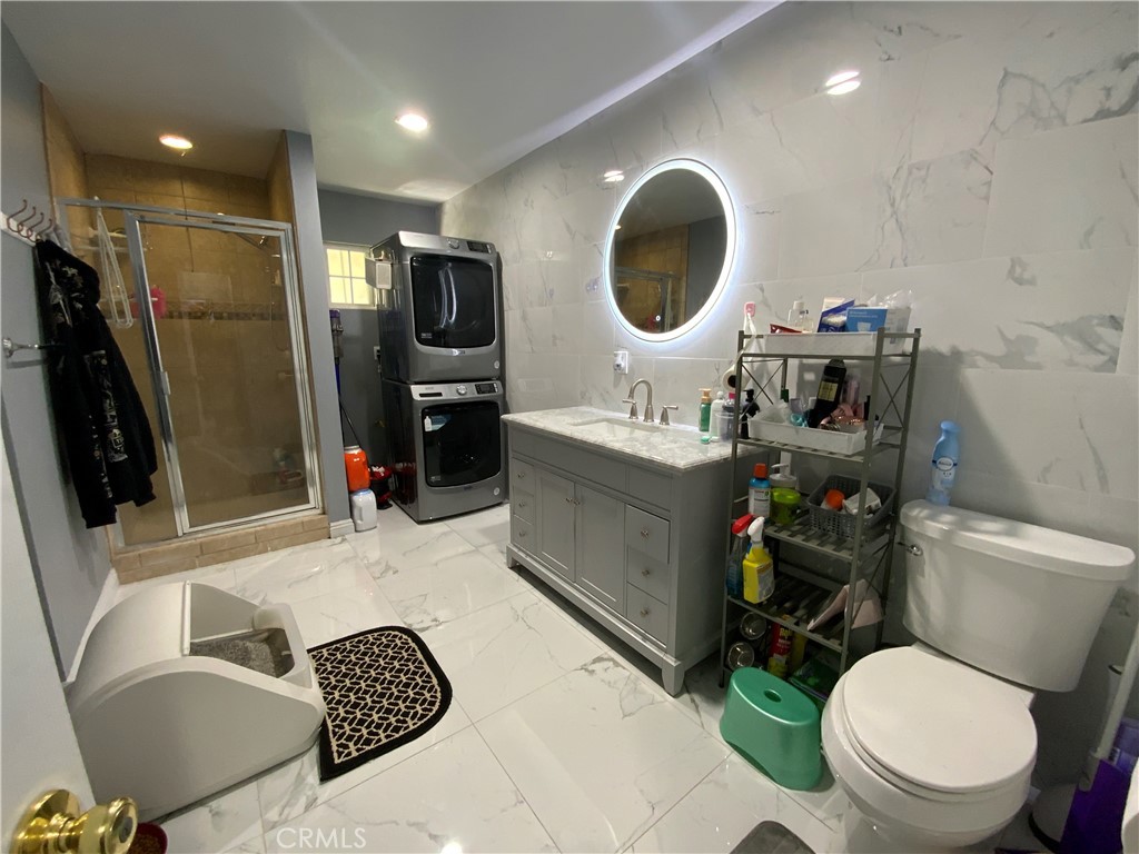 4131 Rowland Avenue El Monte, CA 91731 - Photo 9 of 22 a bathroom with a toilet a sink and a mirror