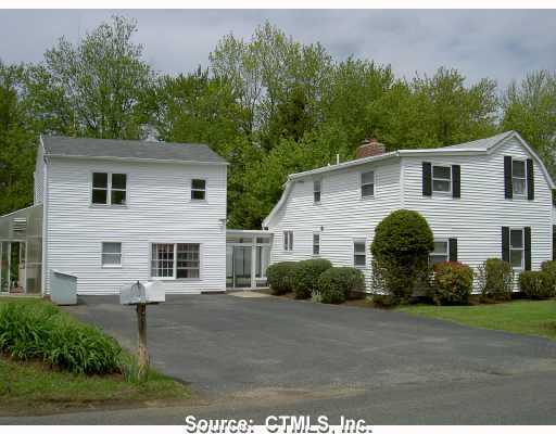 48 High Bridge Road Litchfield, CT 06750 - Photo 1 of 1 a view of a white house with a yard and plants