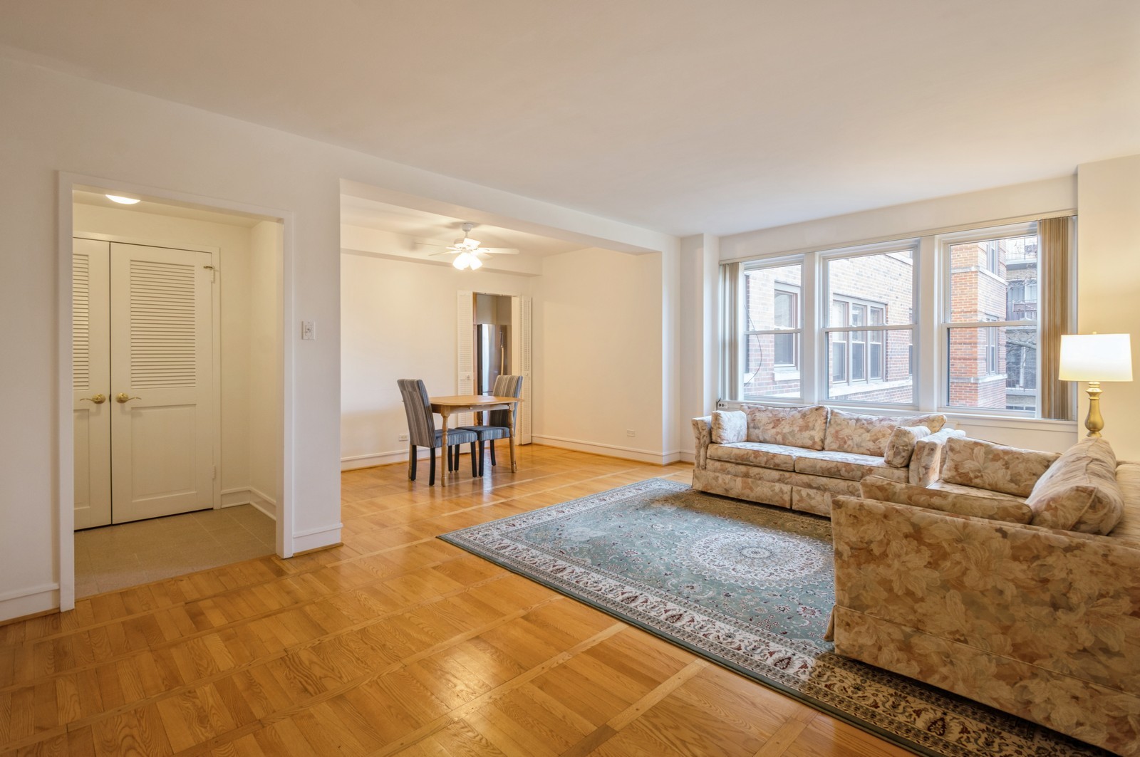 1585 Ridge Avenue, Unit 302 Evanston, IL 60201 - Photo 2 of 21 a living room with furniture and a large window