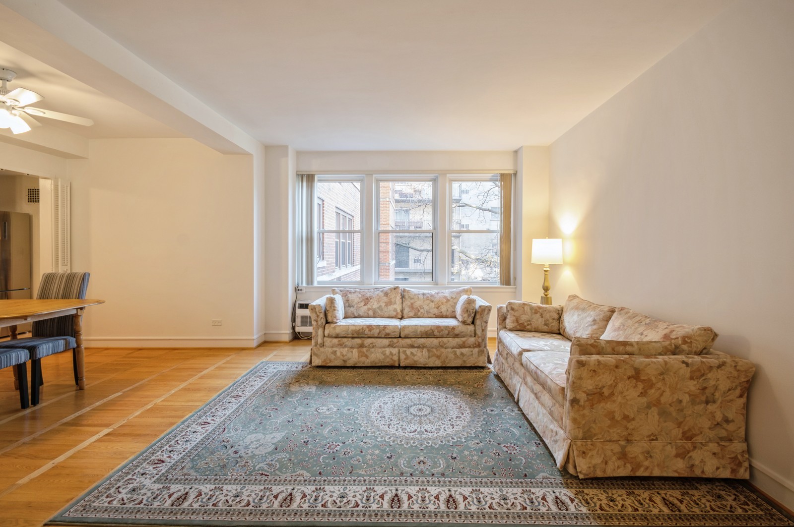 1585 Ridge Avenue, Unit 302 Evanston, IL 60201 - Photo 3 of 21 a living room with furniture and a rug