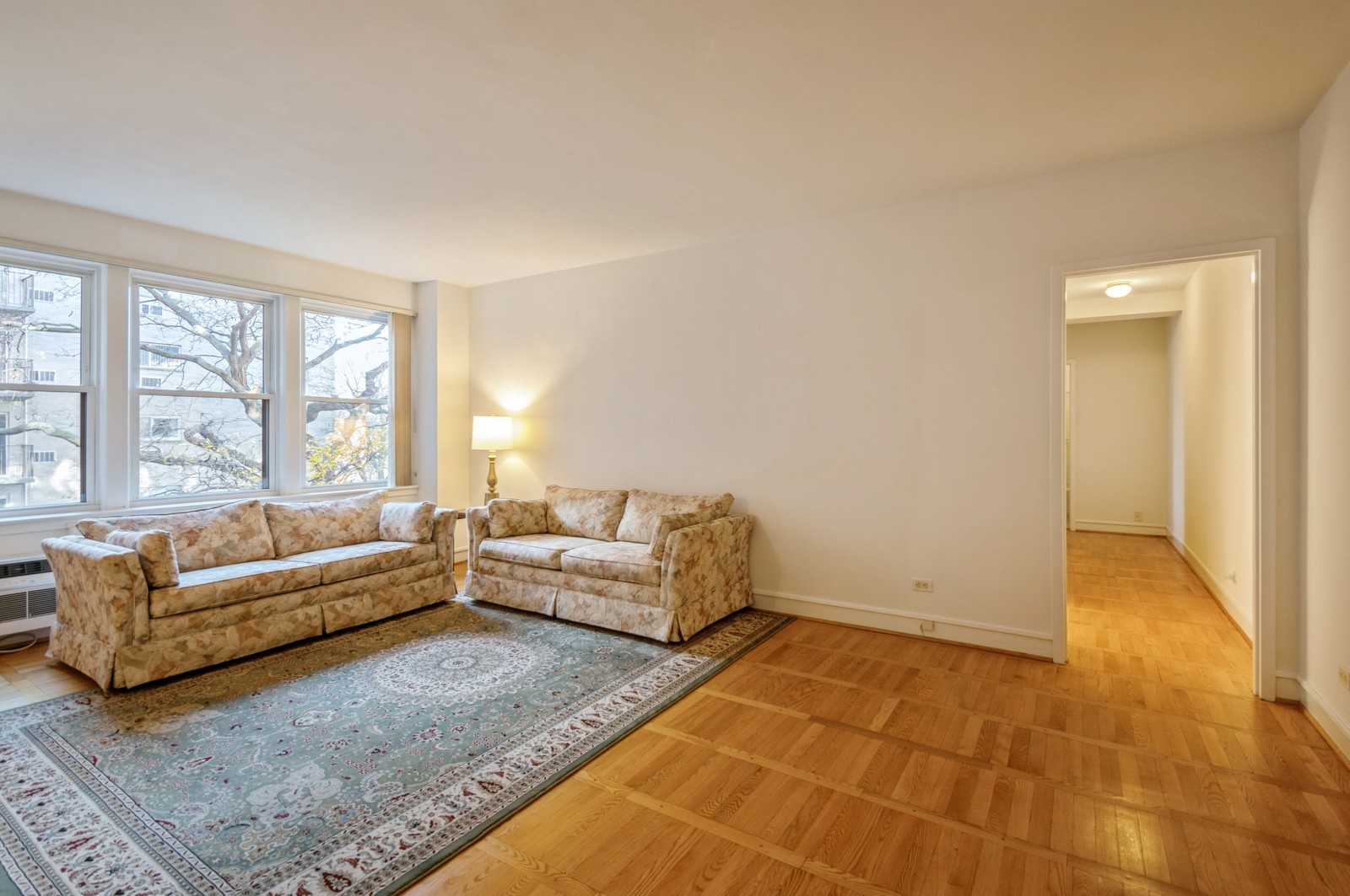 1585 Ridge Avenue, Unit 302 Evanston, IL 60201 - Photo 4 of 21 a living room with furniture and a large window