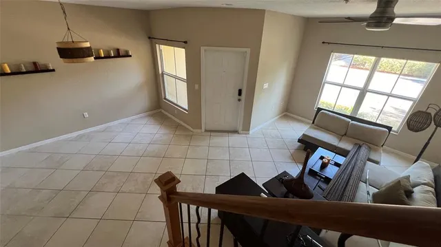 a view of a livingroom with furniture and window
