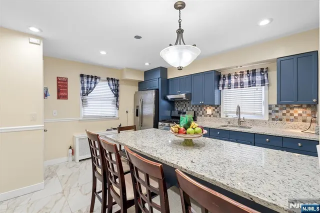 a kitchen with a counter space cabinets and appliances
