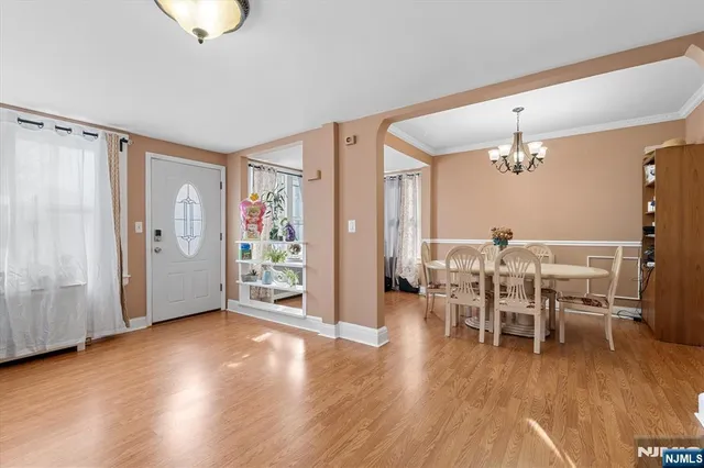 a view of a livingroom with furniture and wooden floor