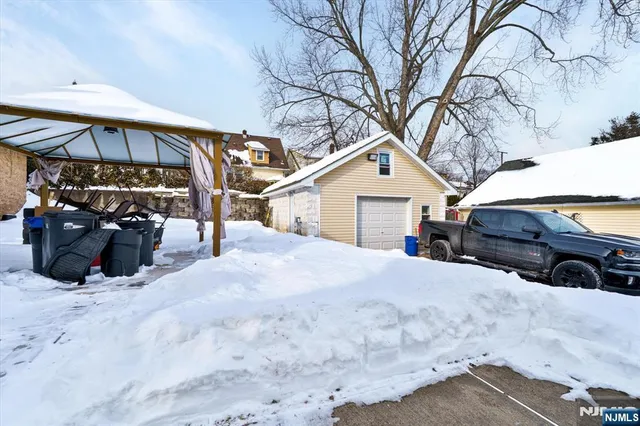 a view of a house with a snow in the yard
