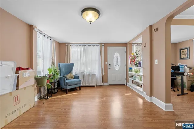 a view of a livingroom with furniture and a window