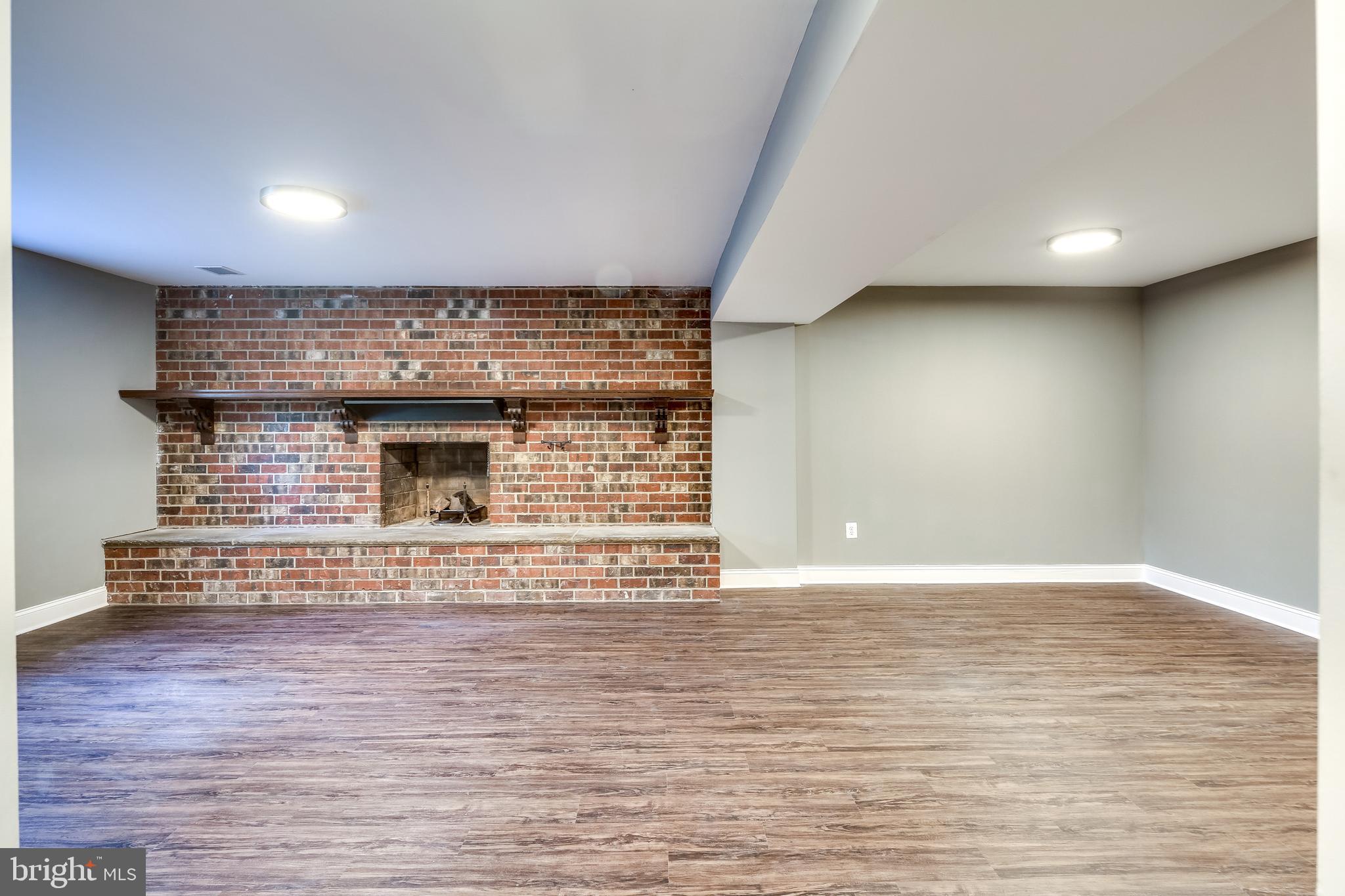 7109 Redmiles Road Laurel, MD 20707 - Photo 21 of 35 Finished Basement with Fireplace