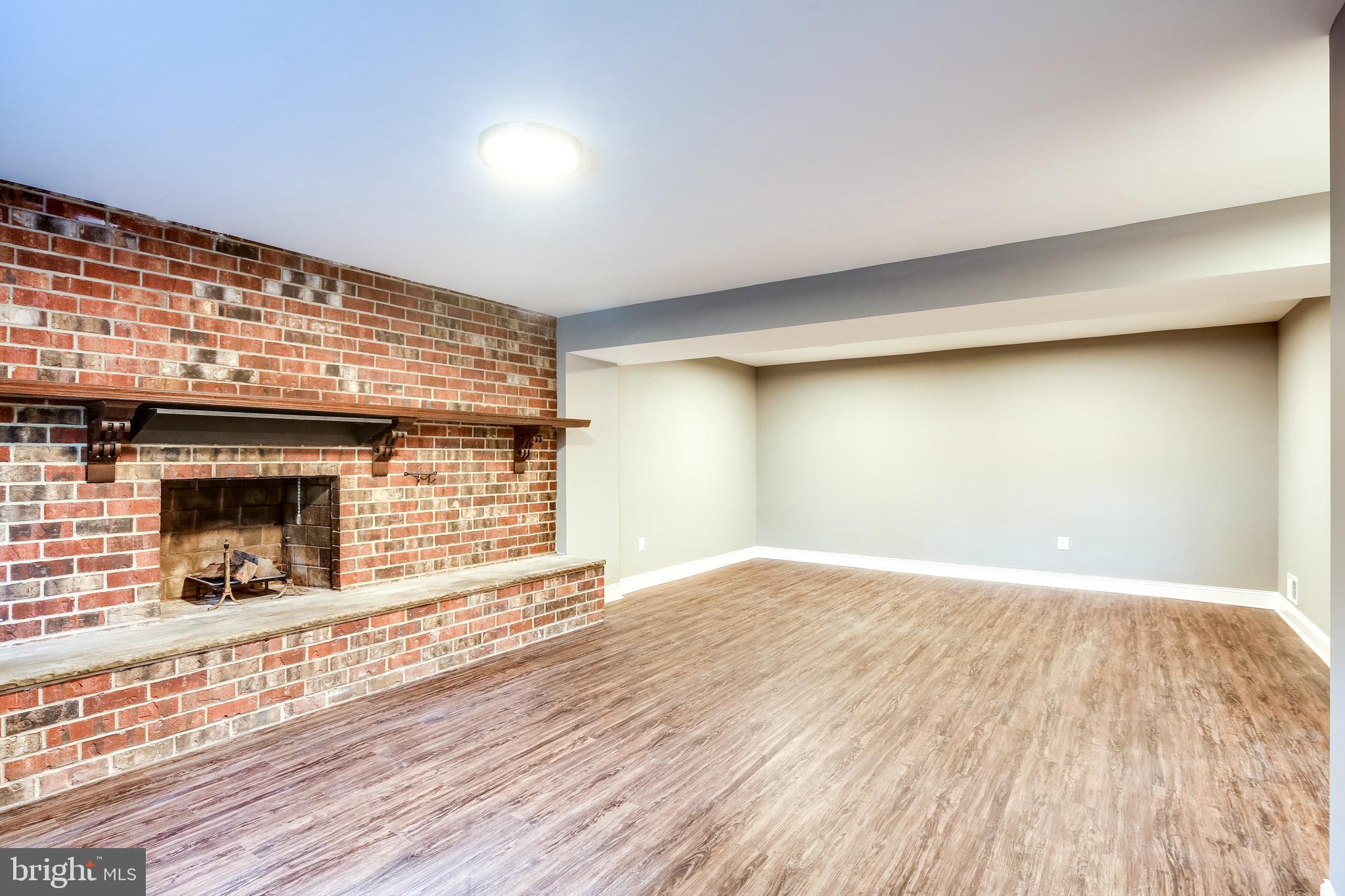 7109 Redmiles Road Laurel, MD 20707 - Photo 22 of 35 Brick Surround Fireplace