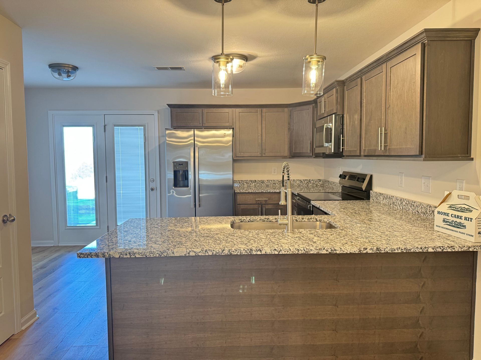 130 Quarry Point Drive Clarksville, TN 37043 - Photo 5 of 21 a kitchen with stainless steel appliances granite countertop a sink refrigerator and microwave