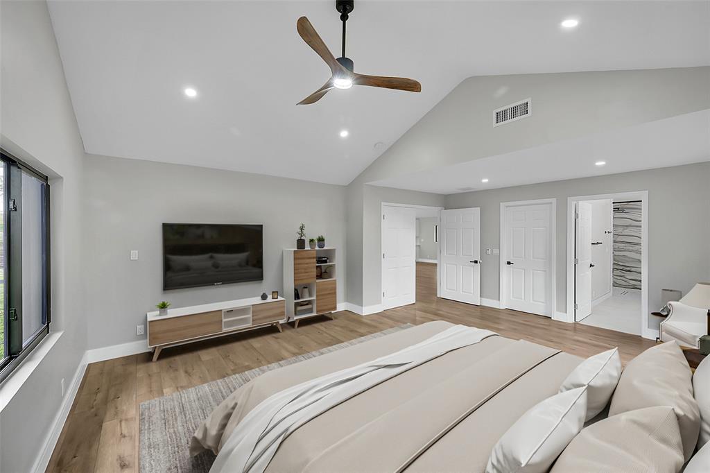 6195 Winding Brook Way Delray Beach, FL 33484 - Photo 26 of 68 a bedroom with a bed and a flat screen tv