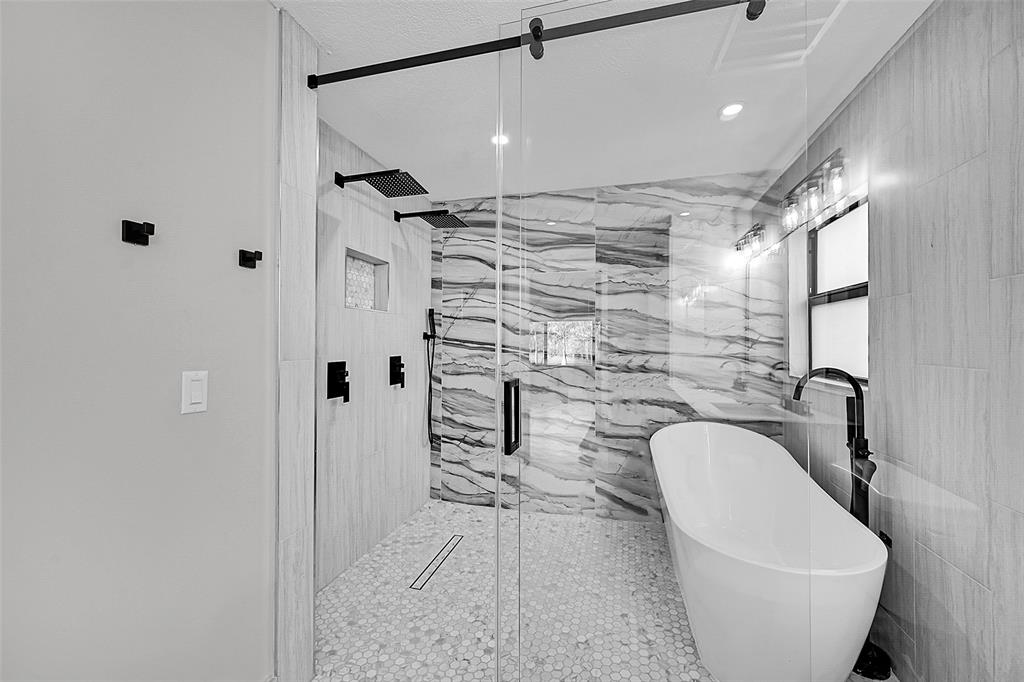 6195 Winding Brook Way Delray Beach, FL 33484 - Photo 30 of 68 a bathroom with a granite countertop sink a mirror and shower