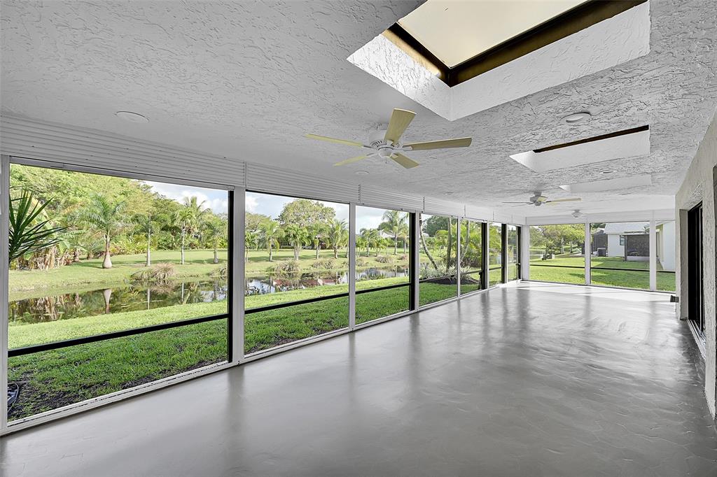 6195 Winding Brook Way Delray Beach, FL 33484 - Photo 39 of 68 a view of empty room with wooden floor and fan