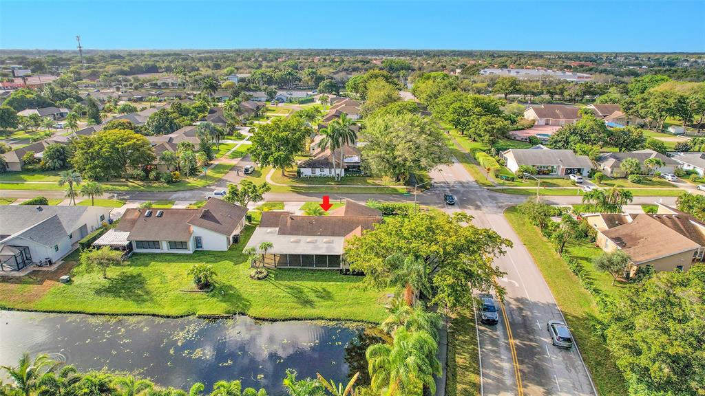 6195 Winding Brook Way Delray Beach, FL 33484 - Photo 61 of 68 an aerial view of residential houses with outdoor space and swimming pool