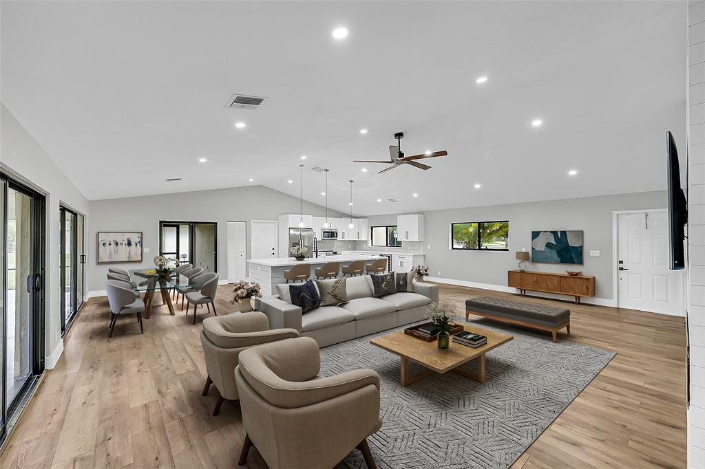 6195 Winding Brook Way Delray Beach, FL 33484 - Photo 9 of 68 a living room with furniture and wooden floor