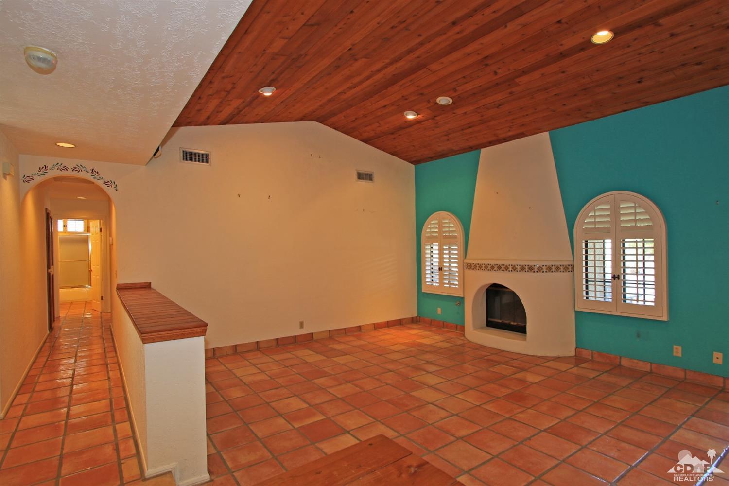 70400 Chappel Road Rancho Mirage, CA 92270 - Photo 13 of 49 a view of a livingroom with a fireplace and window
