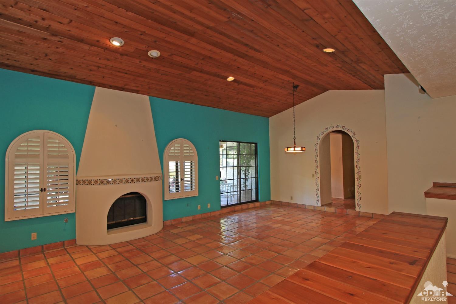 70400 Chappel Road Rancho Mirage, CA 92270 - Photo 14 of 49 a view of a livingroom with a fireplace furniture a window and a fireplace