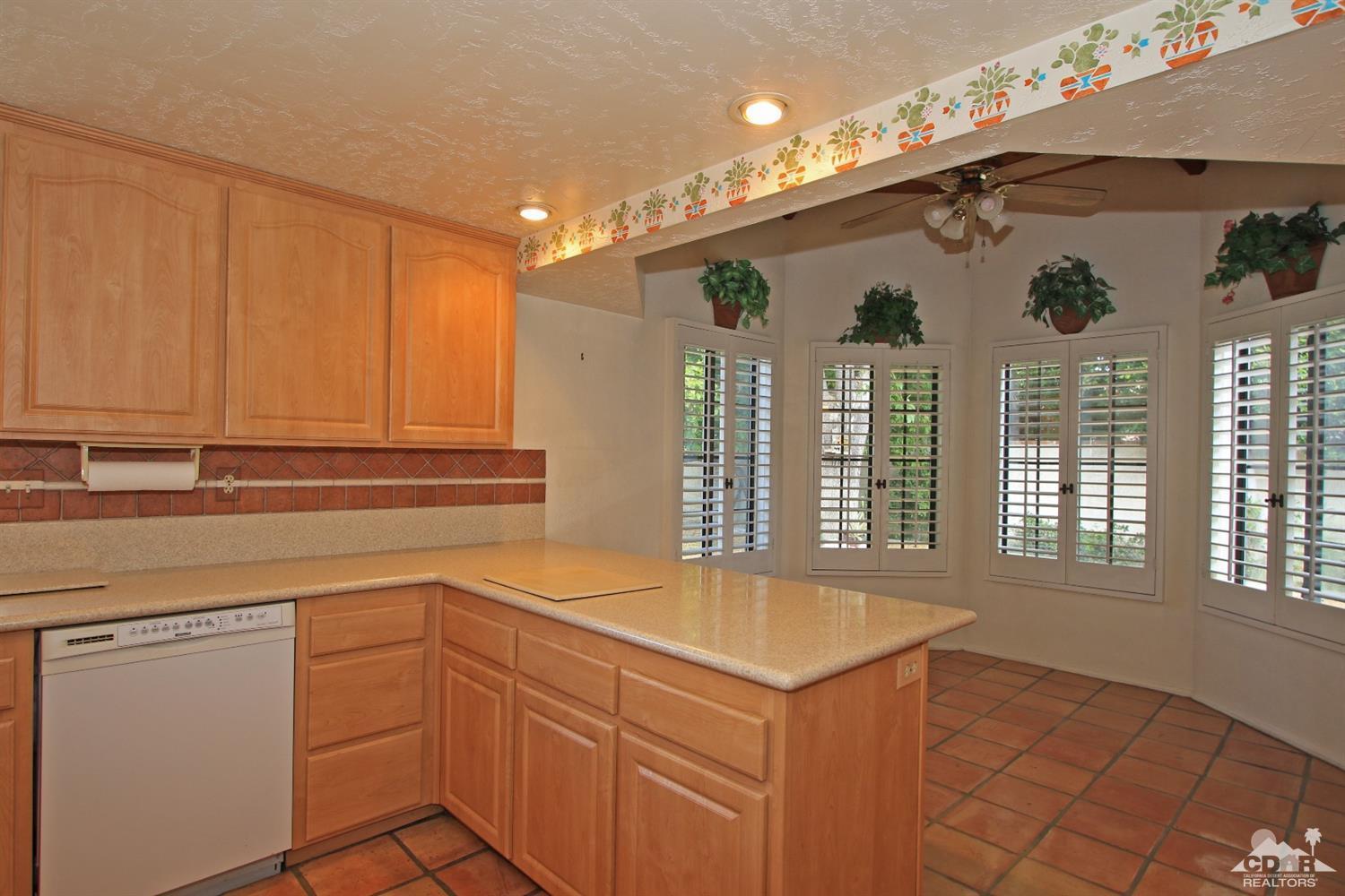 70400 Chappel Road Rancho Mirage, CA 92270 - Photo 22 of 49 a kitchen with a sink cabinets and window